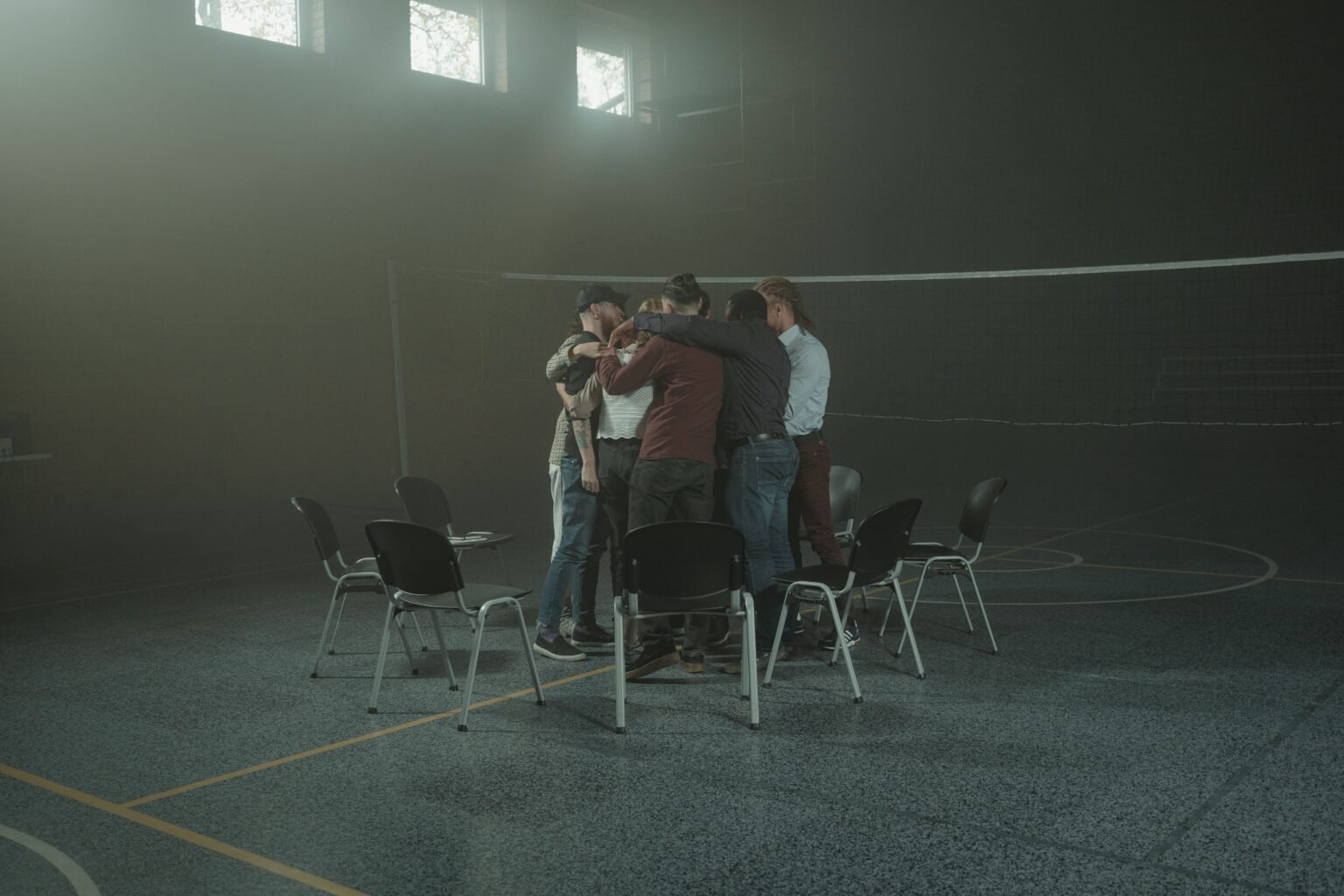 People supporting one another with an embrace